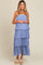 woman wearing a light blue tiered maternity maxi dress with elastic bodice and relaxed fit, showcasing a baby bump