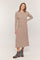 woman wearing a long sleeve beige knit midi dress paired with black ankle boots