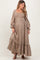 woman wearing a brown floral embroidered maternity maxi dress with a smocked bodice and long sleeves, baby bump visible