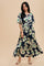 woman wearing a navy floral maxi dress with short sleeves and a cinched waist, styled with flat sandals