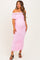 woman wearing a light pink off-the-shoulder maternity dress with ruched details and a visible baby bump