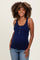 woman wearing a navy blue ribbed maternity tank top with button details and showcasing her baby bump