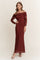 woman wearing a deep red off-the-shoulder long sleeve maxi dress with ruched detailing