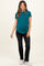woman wearing a teal maternity t-shirt and black jeans with a visible baby bump