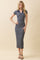 woman wearing a navy and white striped midi dress with a v-neck and short sleeves