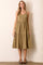 woman wearing an olive green button-up midi dress with a tiered skirt and adjustable straps