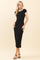 woman wearing a black midi dress with contrasting white short sleeves and stylish high heels