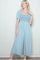 woman wearing a light blue puff sleeve jumpsuit with a smocked bodice and wide-leg pants