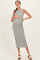 woman wearing a striped gray and white midi maternity dress and holding her baby bump