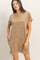 woman wearing a beige short sleeve casual dress with a pocket and side slits