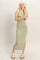 woman wearing a light green ribbed maxi dress with a side slit and sandals