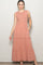 woman wearing a dusty pink tiered maxi dress with ruffled straps and pockets