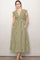 woman wearing a green and white gingham midi dress with cap sleeves and side pockets
