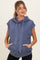 woman wearing a navy blue sleeveless hoodie with a drawstring and front pockets, maternity wear