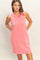 woman wearing a pink sleeveless casual dress with a relaxed fit