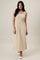 woman wearing a beige striped maxi dress with a fitted waist and side slits