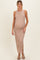 woman wearing a beige ribbed maternity maxi dress with side slits and a visible baby bump
