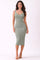 woman wearing a form-fitting olive green ribbed midi dress with a v-neckline and spaghetti straps