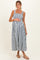 woman wearing a blue and white striped maternity maxi dress with a gathered bodice and holding her baby bump