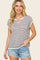 woman wearing a striped short sleeve top with a V-neck and denim shorts