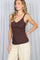 woman wearing a brown ribbed tank top with scalloped edges and styled with cream wide-leg trousers