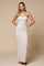 woman wearing a cream floral print maxi dress with thin straps and a ruched bust detail