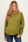woman wearing a green textured maternity sweater with long sleeves and a relaxed fit, highlighting her baby bump