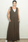 woman wearing a brown sleeveless maxi dress with side pockets and a v-neckline
