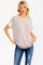 woman wearing a striped short sleeve top with pastel color blocking and distressed blue jeans
