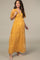 woman wearing a yellow floral lace maternity maxi dress, featuring a deep V-neck and short sleeves, with a visible baby bump