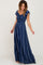 woman wearing a navy blue striped maxi dress with ruffled sleeves and a tiered skirt