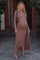 woman wearing a brown ribbed maternity dress with a matching long cardigan, highlighting her baby bump