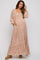 woman wearing a floral print maxi maternity dress with long puff sleeves and pockets