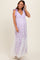 woman wearing a lilac maternity maxi dress with floral patterns and lace details, showcasing her baby bump