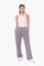 woman wearing a pink ribbed tank top and gray wide-leg sweatpants with pockets