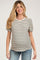 woman wearing a striped short sleeve maternity top with puff sleeves and a baby bump visible