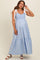 woman wearing a light blue maternity maxi dress with smocked bodice and white tie straps, showcasing a baby bump