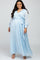 Woman in light blue long sleeve maternity maxi dress with wrap front and waist tie