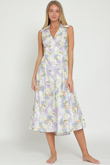 woman wearing a floral sleeveless midi dress with a v-neck and flared skirt