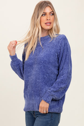 woman wearing a relaxed fit purple oversized sweater with ribbed hem and sleeves