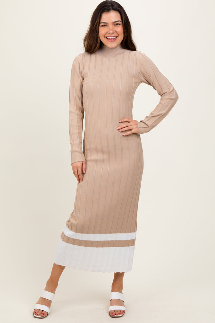 woman wearing a beige ribbed long sleeve midi dress with white stripes at the hem and smiling