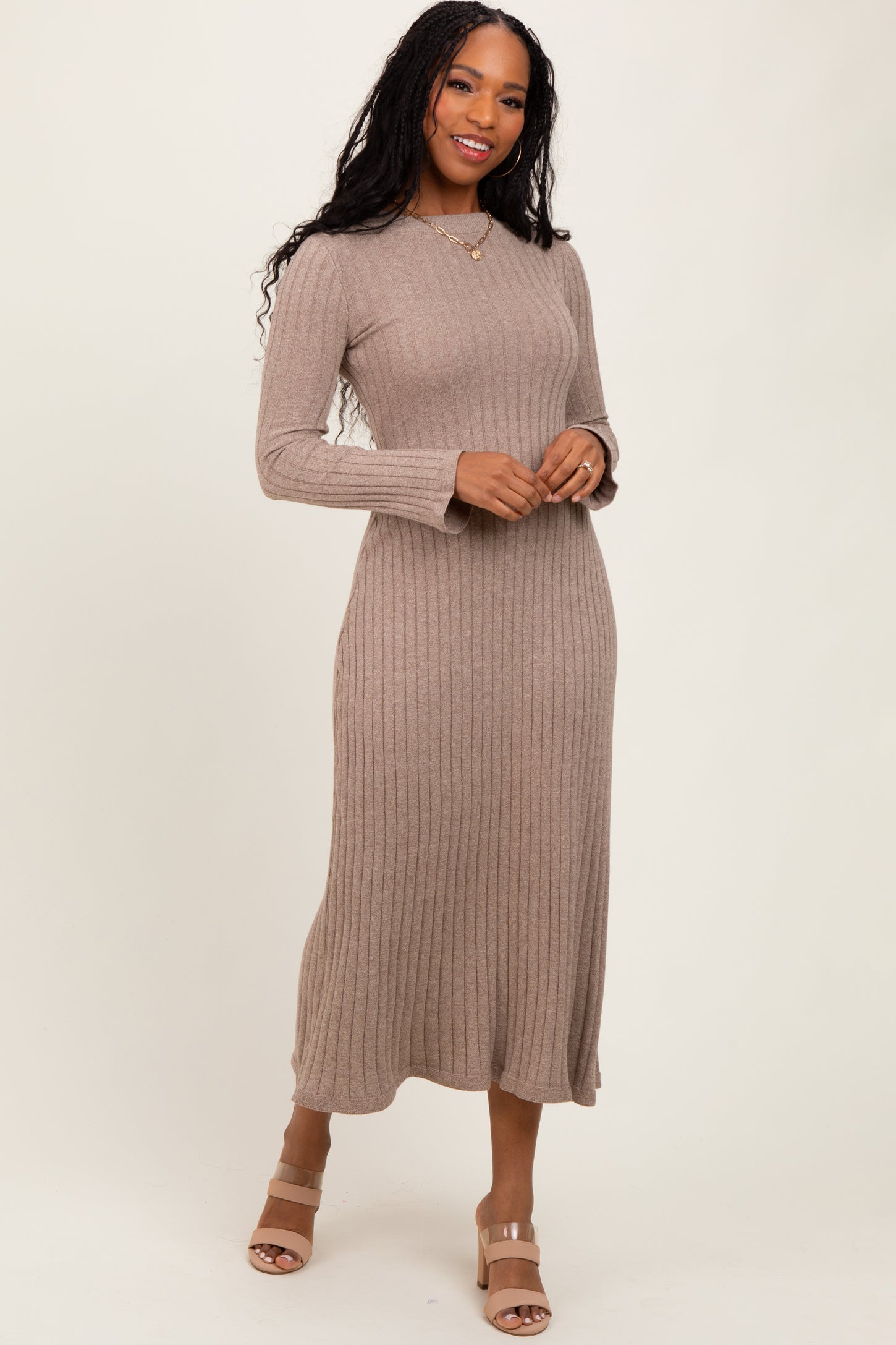 woman wearing a taupe ribbed long sleeve midi dress and tan block heel sandals