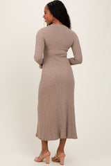 woman wearing a beige ribbed midi dress with long sleeves, shown from the back