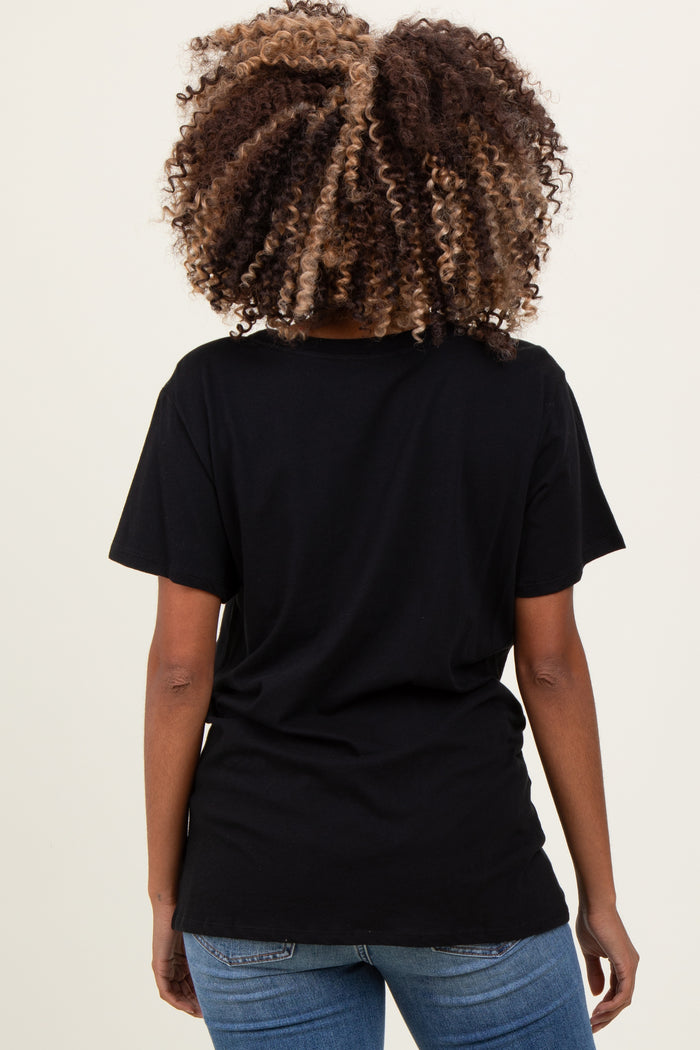 woman wearing a black short sleeve maternity t-shirt, showing the back view