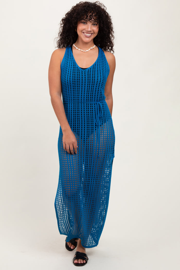 woman wearing a deep blue open-knit maxi dress with a tie waist and a v-neckline