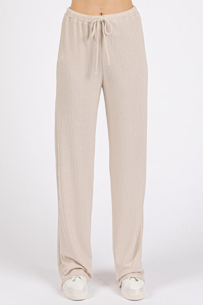 woman wearing beige ribbed wide-leg pants with drawstring waistband