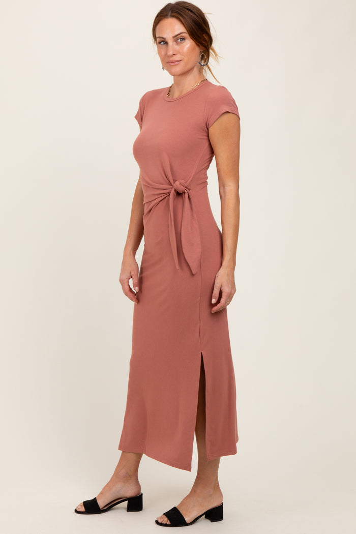 woman wearing a dusty rose maxi dress with a side tie and slit, styled with black sandals