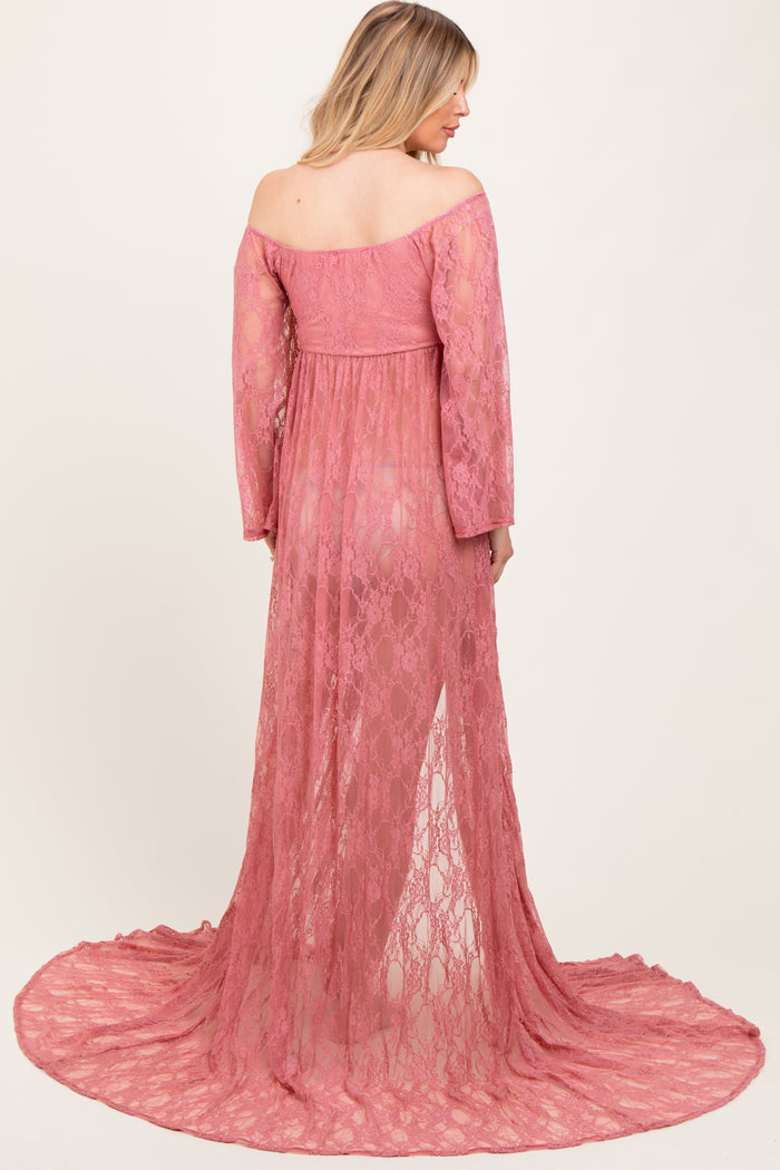 woman wearing a dusty rose lace maternity dress with off-shoulder sleeves and a flowing train, showcasing a baby bump