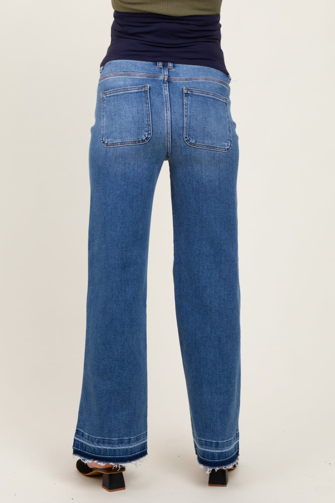 woman wearing blue wide leg maternity jeans, shown from the back