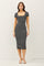 woman wearing a black and white striped short sleeve bodycon dress with a square neckline